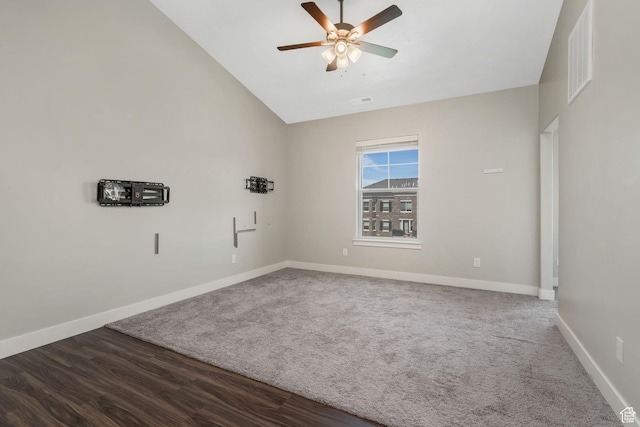 13073 S Newbridge Ln Unit E301, Herriman, UT 84096 - spare room with ceiling fan, vaulted ceiling, dark carpet, and dark wood-style flooring