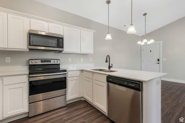 13073 S Newbridge Ln Unit E301, Herriman, UT 84096 - kitchen with stainless steel appliances, a peninsula, dark wood-style flooring, light countertops, and vaulted ceiling