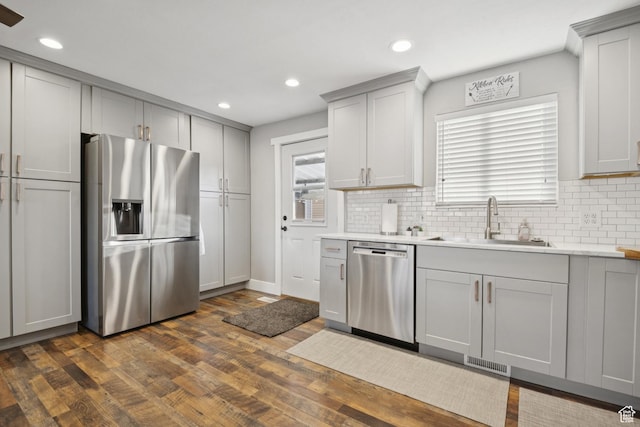 5964 S 610 W, Murray, UT 84123 - kitchen featuring appliances with stainless steel finishes, gray cabinets, tasteful backsplash, dark wood-style floors, and light countertops