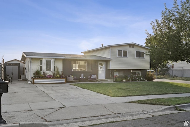 5964 S 610 W, Murray, UT 84123 - split level home with concrete driveway, a storage shed, and a front yard