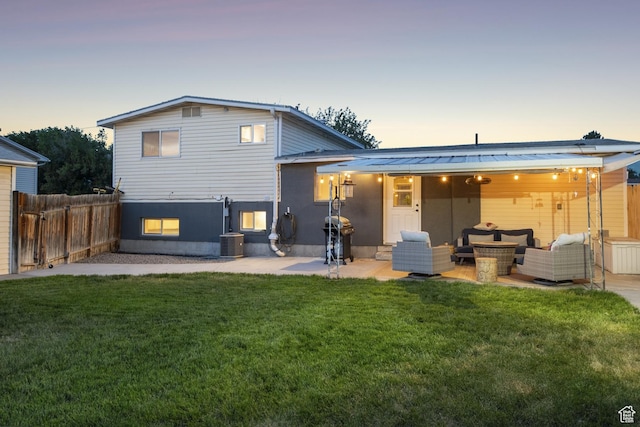 5964 S 610 W, Murray, UT 84123 - back of house at dusk with outdoor lounge area and a patio