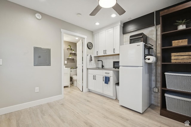 5964 S 610 W, Murray, UT 84123 - kitchen with freestanding refrigerator, electric panel, light wood-style floors, ceiling fan, and recessed lighting