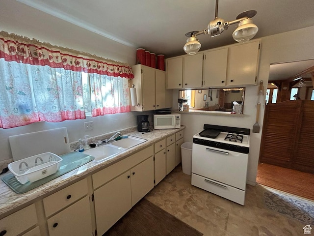 468 E Trail Rd, Brian Head, UT 84719 - kitchen featuring white appliances, light countertops, and white cabinets