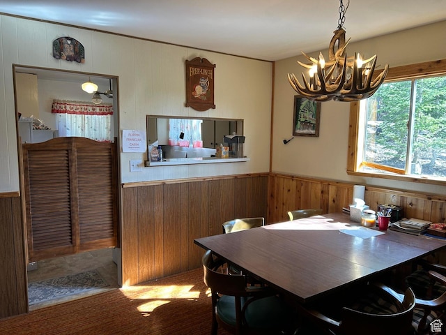 468 E Trail Rd, Brian Head, UT 84719 - dining area with a chandelier, wood walls, and a wainscoted wall