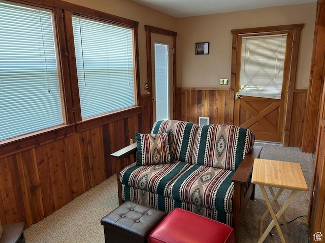 468 E Trail Rd, Brian Head, UT 84719 - living area with wooden walls, carpet flooring, and a wainscoted wall