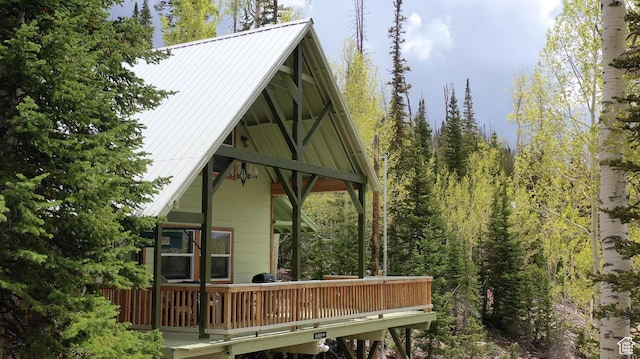 468 E Trail Rd, Brian Head, UT 84719 - back of house with a metal roof, a deck, and a wooded view