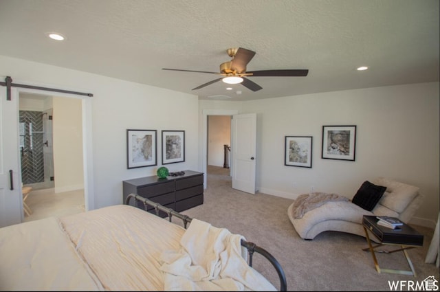 3999 W 2050 S, Taylor, UT 84401 - bedroom with recessed lighting, light colored carpet, a barn door, a textured ceiling, and a ceiling fan
