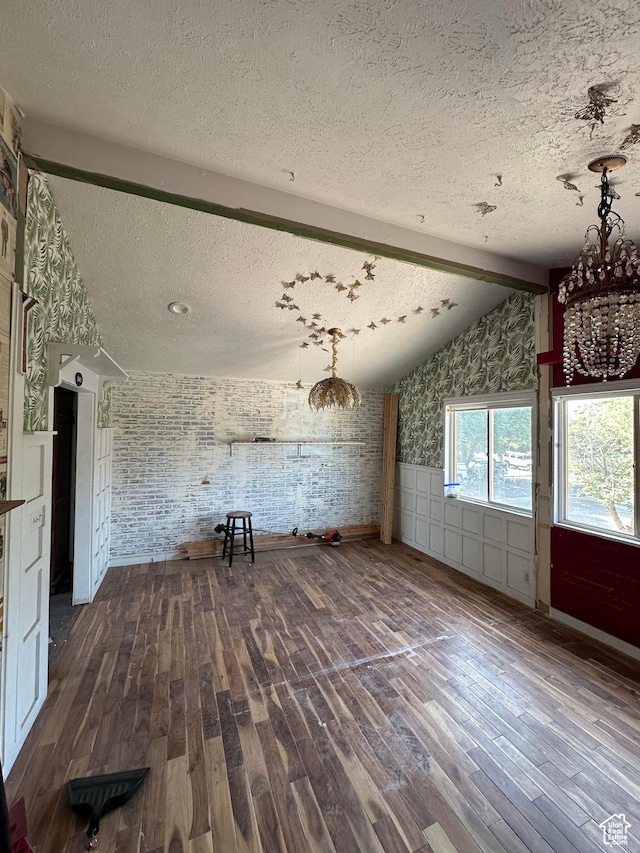 3836 W Jacquelyn St S, West Jordan, UT 84088 - unfurnished living room with a textured ceiling, dark wood-style floors, wainscoting, and a chandelier