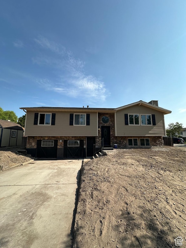3836 W Jacquelyn St S, West Jordan, UT 84088 - raised ranch featuring stone siding and a storage unit