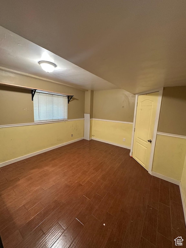 3836 W Jacquelyn St S, West Jordan, UT 84088 - basement featuring dark wood-style floors and baseboards