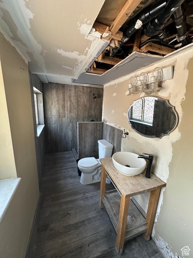 3836 W Jacquelyn St S, West Jordan, UT 84088 - bathroom with hardwood / wood-style floors, vanity, a shower, and wood walls
