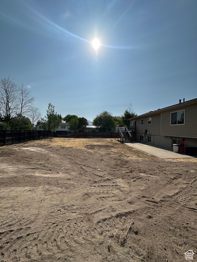 3836 W Jacquelyn St S, West Jordan, UT 84088 - view of yard with a patio and stairway