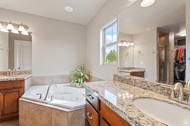 10787 N Town Center Pkwy, Highland, UT 84003 - full bathroom with a stall shower, a tub with jets, two vanities, and a spacious closet