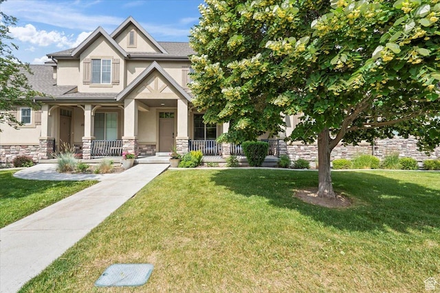 10787 N Town Center Pkwy, Highland, UT 84003 - craftsman-style house with stucco siding, covered porch, stone siding, and a front lawn