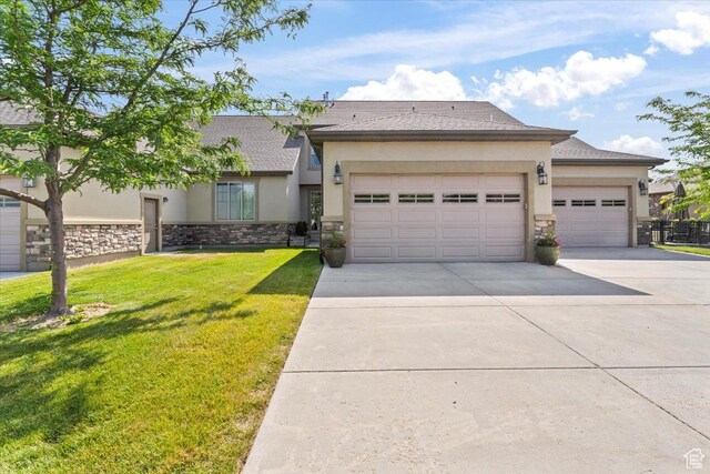 10787 N Town Center Pkwy, Highland, UT 84003 - view of front of house featuring stone siding, concrete driveway, a garage, stucco siding, and a front yard