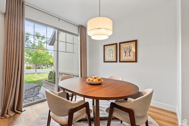 10787 N Town Center Pkwy, Highland, UT 84003 - dining room featuring light wood-type flooring