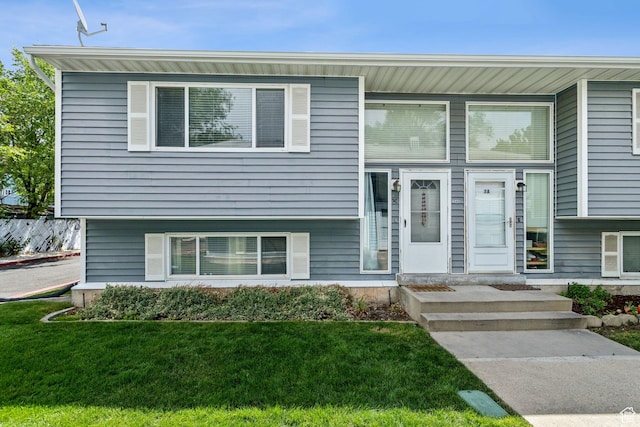 248 E Winslow Ave S Unit 3-C, South Salt Lake, UT 84115 - tri-level home featuring a front lawn