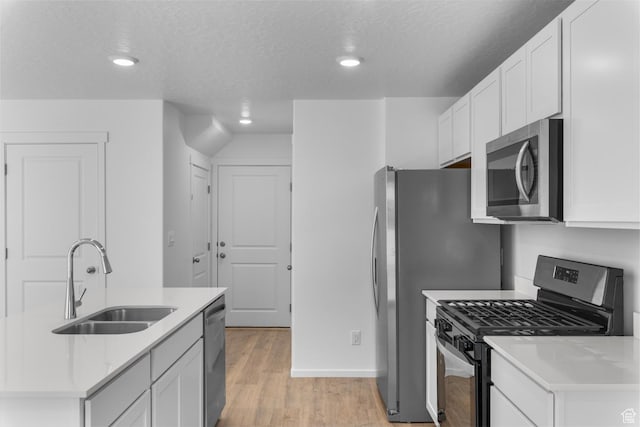 554 W 1870 S Unit 1195, Provo, UT 84601 - kitchen with stainless steel appliances, light countertops, light wood-type flooring, white cabinetry, and recessed lighting