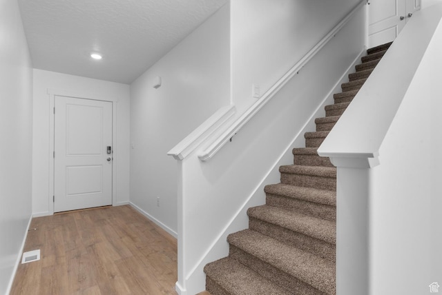 554 W 1870 S Unit 1195, Provo, UT 84601 - foyer featuring stairs, wood finished floors, and recessed lighting