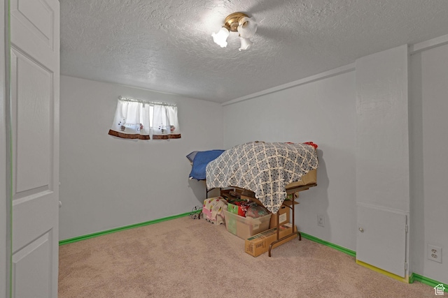 522 E Diana St, South Ogden, UT 84403 - rec room with a textured ceiling and carpet flooring