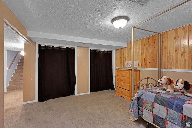 522 E Diana St, South Ogden, UT 84403 - bedroom featuring carpet, a textured ceiling, and wooden walls