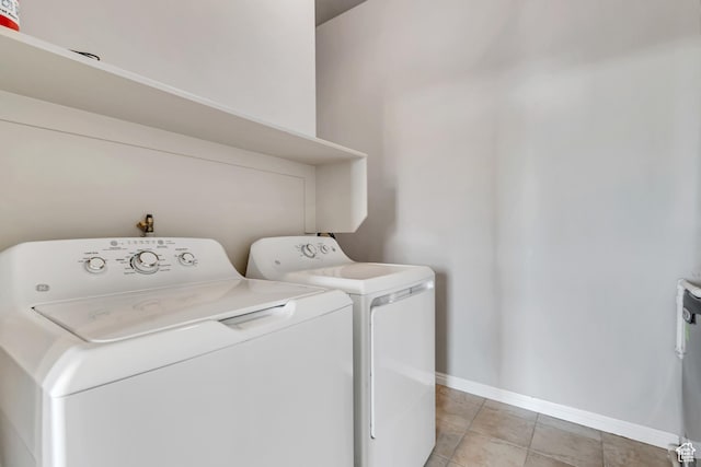 11184 S Waltana Way Unit 205, South Jordan, UT 84095 - laundry area featuring washing machine and dryer and light tile patterned floors