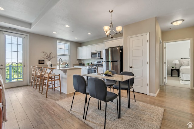 11184 S Waltana Way Unit 205, South Jordan, UT 84095 - dining room with light wood finished floors, a chandelier, and recessed lighting