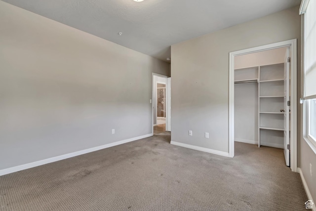 11184 S Waltana Way Unit 205, South Jordan, UT 84095 - unfurnished bedroom featuring carpet flooring, a spacious closet, and a closet