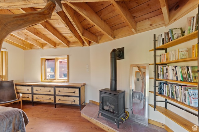 338 Taylor Ln, Castle Valley, UT 84532 - bedroom with a wood ceiling with exposed beams, a wood stove, and wood finished floors