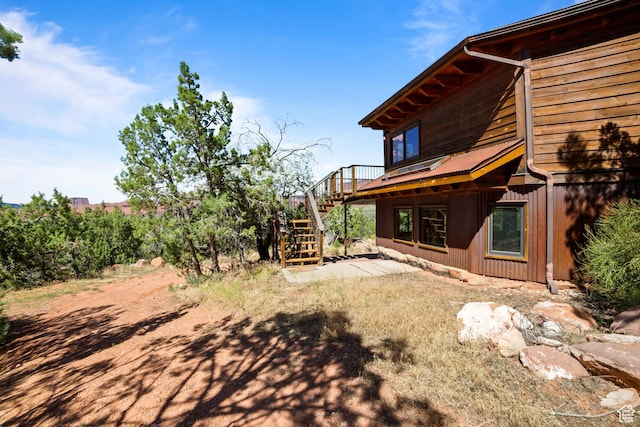 338 Taylor Ln, Castle Valley, UT 84532 - view of yard featuring stairway and a wooden deck