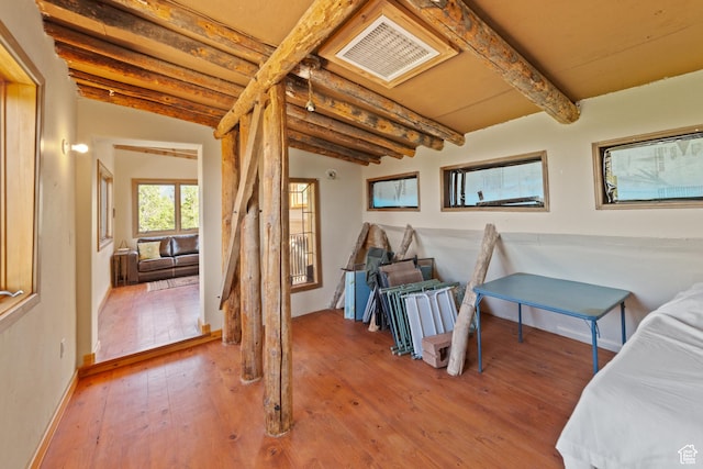 338 Taylor Ln, Castle Valley, UT 84532 - bedroom with beam ceiling and hardwood / wood-style floors