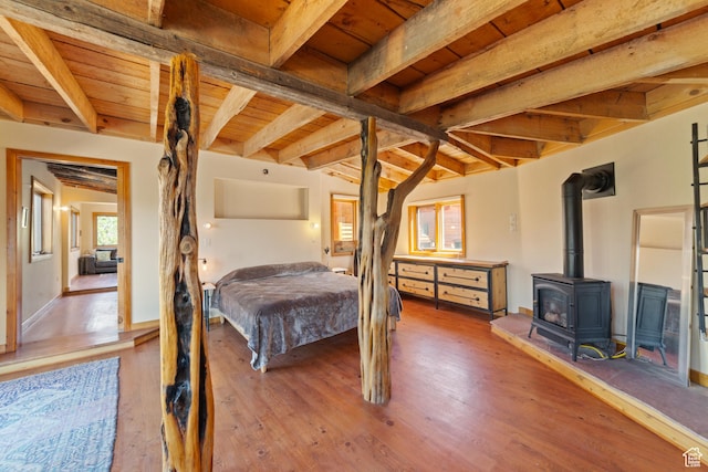 338 Taylor Ln, Castle Valley, UT 84532 - bedroom featuring a wood ceiling with exposed beams, a wood stove, and wood finished floors