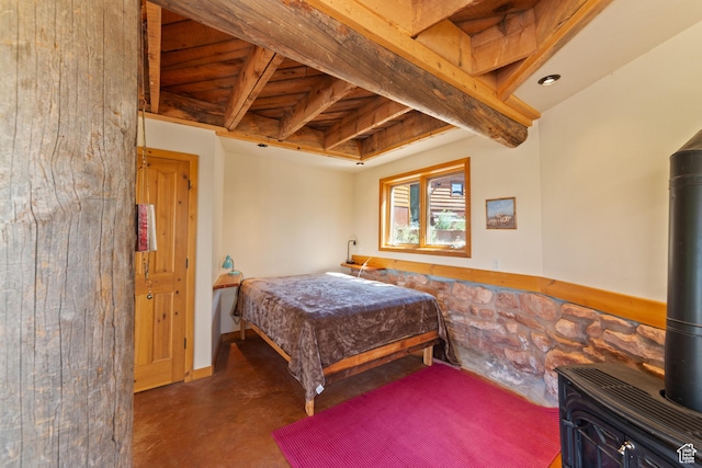 338 Taylor Ln, Castle Valley, UT 84532 - bedroom featuring a wood stove and concrete flooring