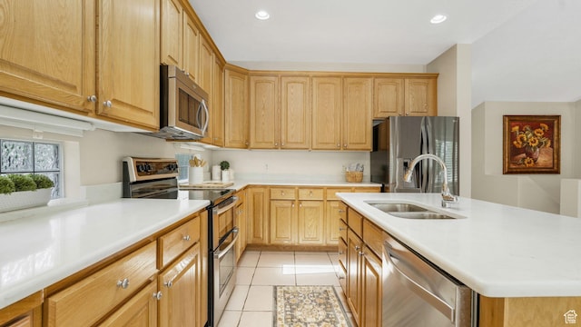 1257 W Bateman Ponds Way S, West Jordan, UT 84084 - kitchen featuring stainless steel appliances, light tile patterned floors, light countertops, and recessed lighting