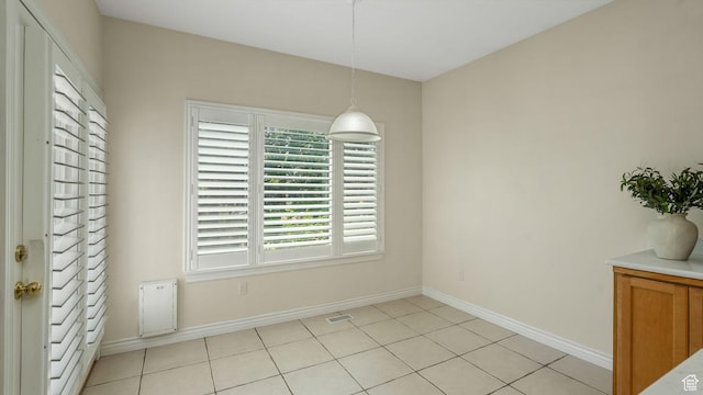 1257 W Bateman Ponds Way S, West Jordan, UT 84084 - unfurnished dining area featuring baseboards and light tile patterned floors