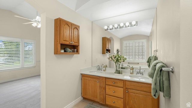 1257 W Bateman Ponds Way S, West Jordan, UT 84084 - full bathroom featuring double vanity, healthy amount of natural light, vaulted ceiling, and ceiling fan