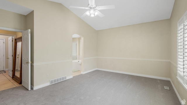 1257 W Bateman Ponds Way S, West Jordan, UT 84084 - unfurnished room with carpet floors, lofted ceiling, a ceiling fan, and arched walkways