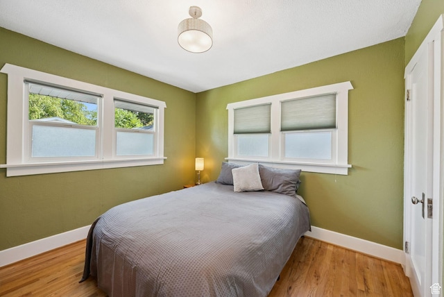 1527 E Emerson Ave S, Salt Lake City, UT 84105 - bedroom featuring wood finished floors