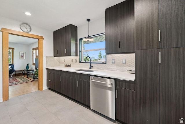 1527 E Emerson Ave S, Salt Lake City, UT 84105 - kitchen with stainless steel dishwasher, light countertops, decorative backsplash, dark brown cabinetry, and recessed lighting