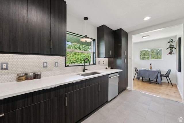 1527 E Emerson Ave S, Salt Lake City, UT 84105 - kitchen with stainless steel dishwasher, light countertops, decorative backsplash, decorative light fixtures, and recessed lighting