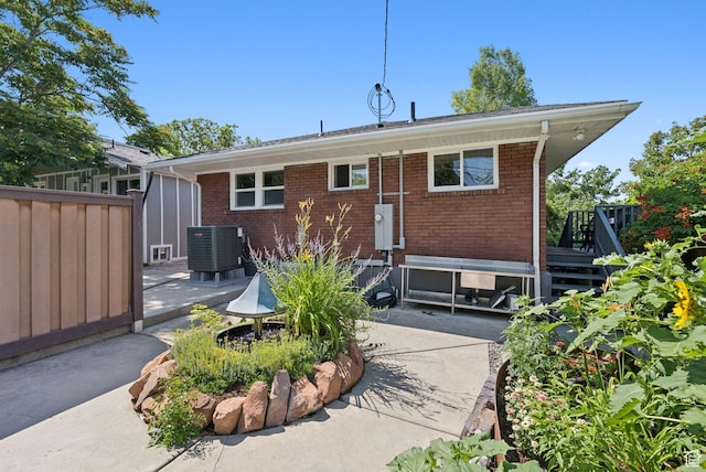 1527 E Emerson Ave S, Salt Lake City, UT 84105 - rear view of house featuring a patio, brick siding, and a deck