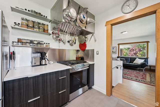 1527 E Emerson Ave S, Salt Lake City, UT 84105 - kitchen featuring gas range, range hood, open shelves, and light tile patterned floors