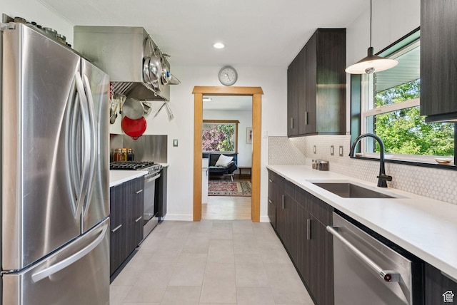 1527 E Emerson Ave S, Salt Lake City, UT 84105 - kitchen featuring appliances with stainless steel finishes, light countertops, decorative backsplash, light tile patterned flooring, and recessed lighting