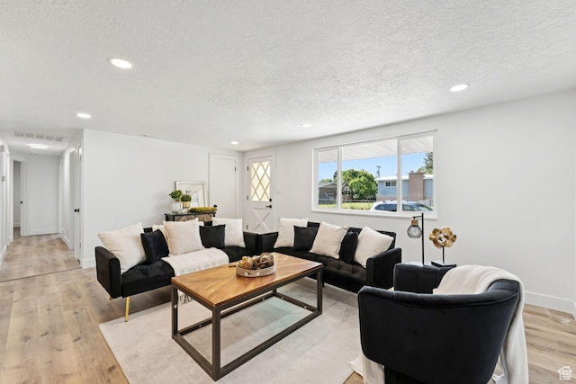 147 E 1700 S, Orem, UT 84058 - living room with a textured ceiling, recessed lighting, and light wood finished floors