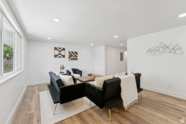 147 E 1700 S, Orem, UT 84058 - living room with a textured ceiling, recessed lighting, and light wood-style floors