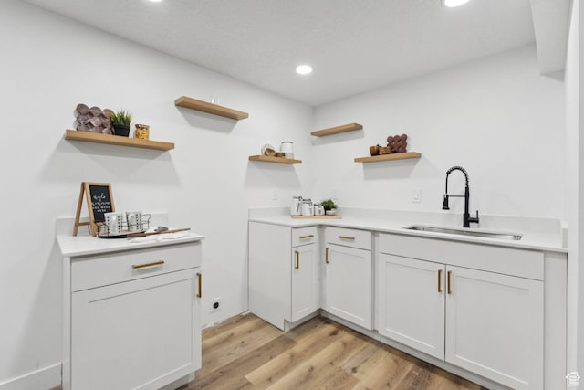 147 E 1700 S, Orem, UT 84058 - kitchen featuring open shelves, recessed lighting, light wood-style flooring, light countertops, and white cabinetry