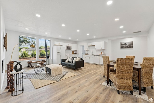 147 E 1700 S, Orem, UT 84058 - dining space with light wood finished floors, recessed lighting, and a fireplace