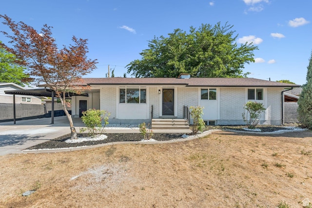 147 E 1700 S, Orem, UT 84058 - ranch-style home featuring brick siding, an attached carport, and driveway