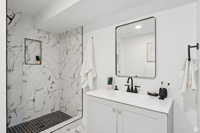 147 E 1700 S, Orem, UT 84058 - bathroom featuring vanity, a marble finish shower, and marble look tiles