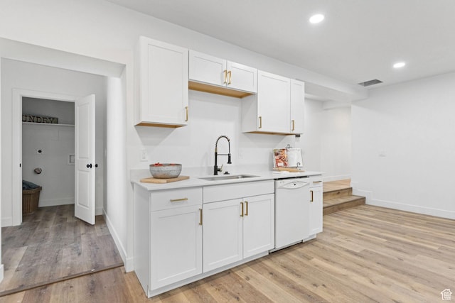 147 E 1700 S, Orem, UT 84058 - kitchen featuring white dishwasher, light countertops, white cabinetry, light wood-type flooring, and recessed lighting